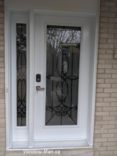 Front door. With sidelight. Blackburn iron glass insert